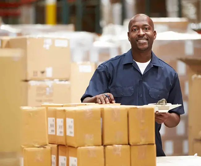 Man working in warehouse with boxes