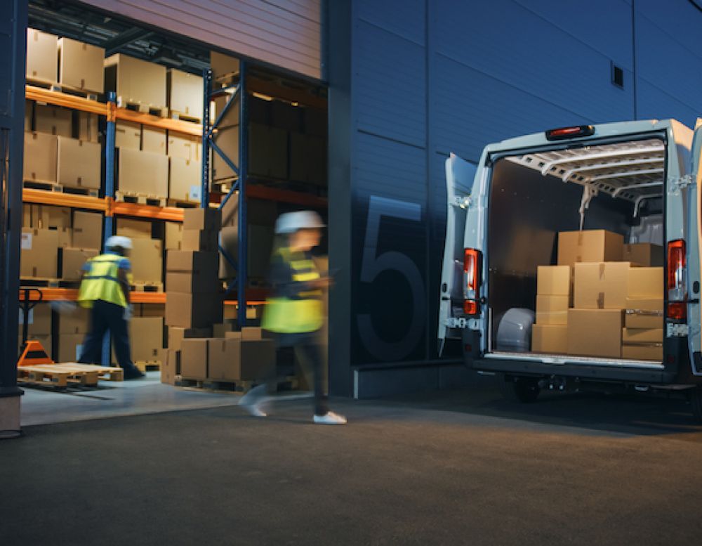 Outside of Logistics Distributions Warehouse Diverse Team of Workers Loading Delivery Truck with Cardboard Boxes. Online Orders, Purchases, E-Commerce Goods, Supply Chain.