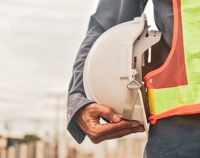 man holding safety hat