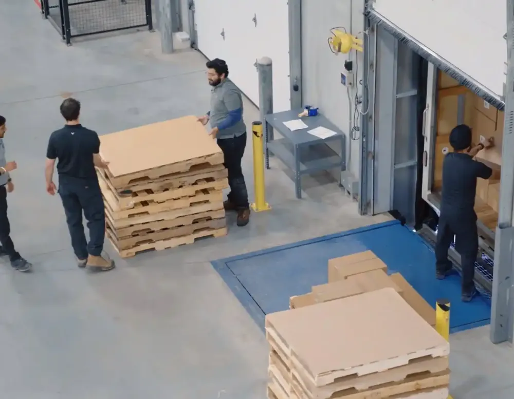 Unloading boxes from a semi- truck.