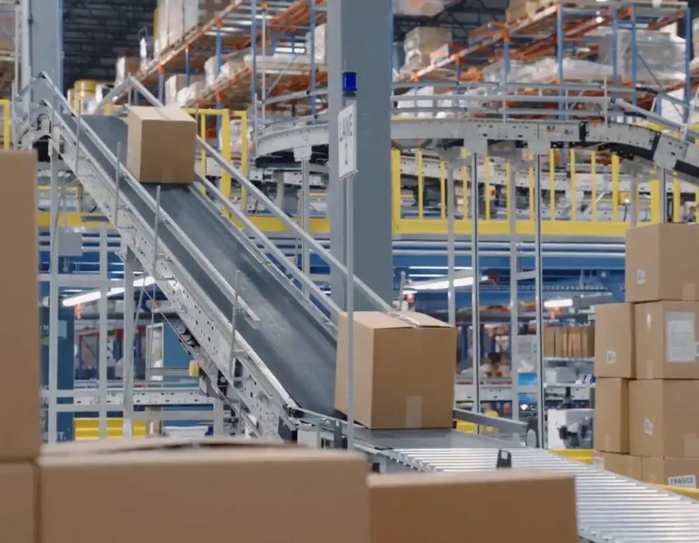 A box being sent down a conveyor belt.