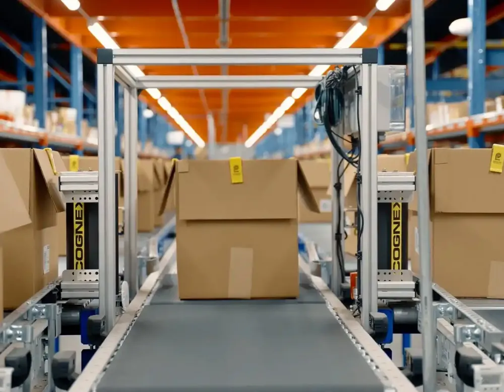 A cardboard box on a conveyor belt.