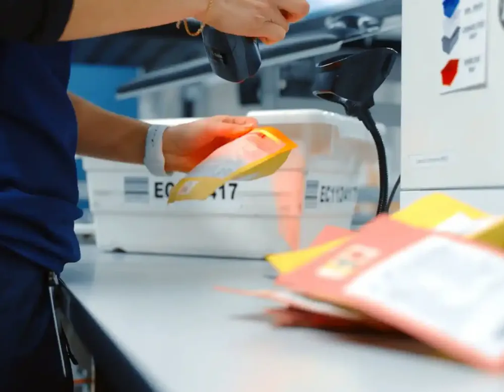A worker scanning a package before it is shipped.